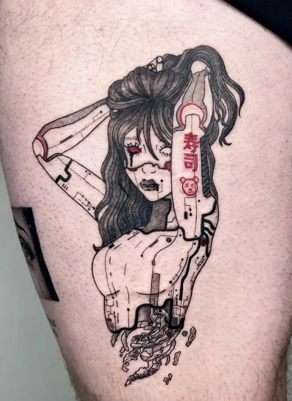Cyberpunk anime character tattoo with futuristic elements and red accents by Ayah at Omnia Tattoo Melbourne